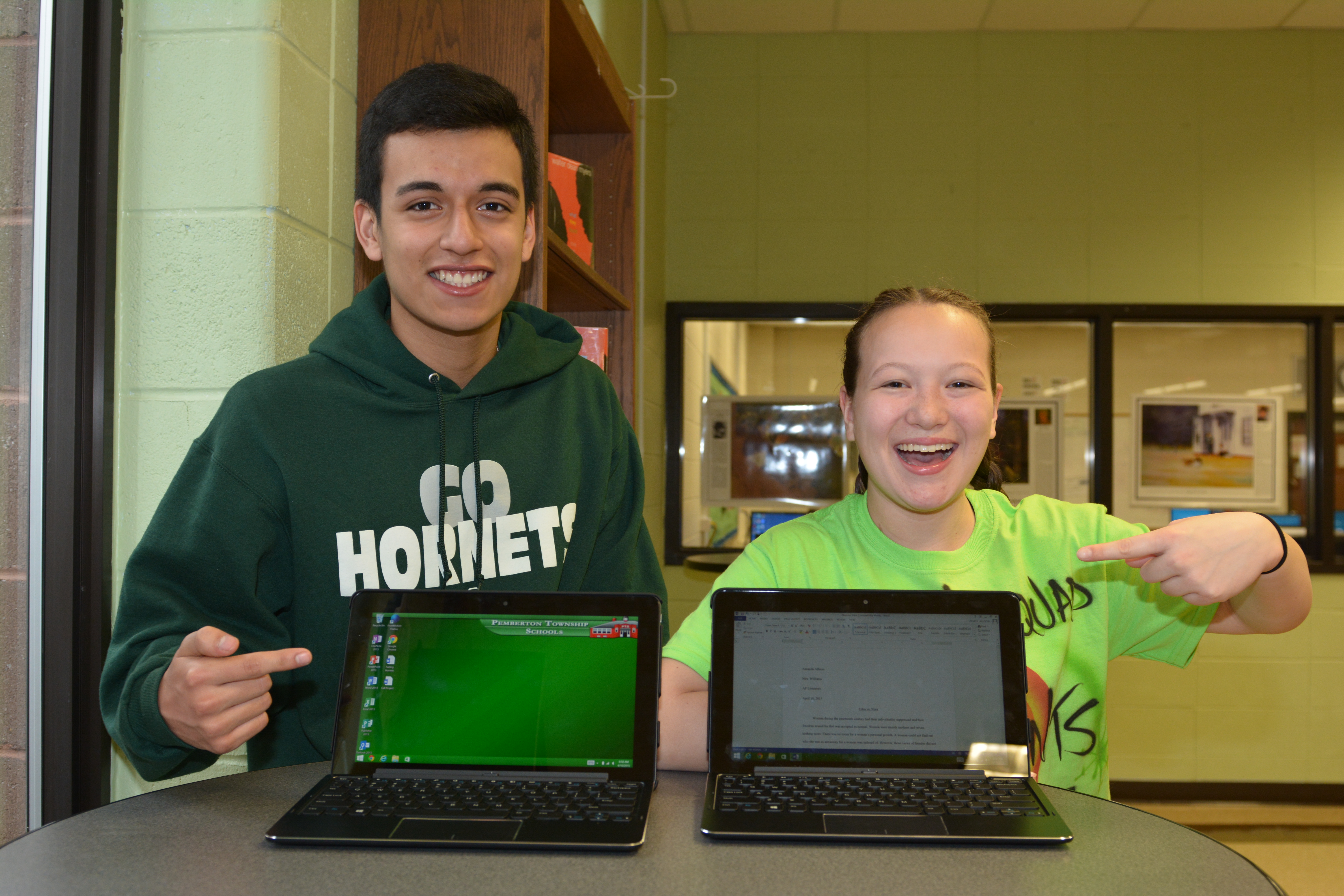 students showing laptops 